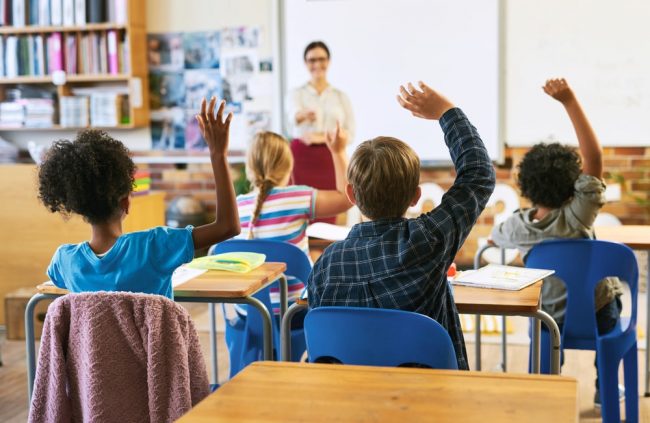 International classroom setting with smaller class sizes and mixed-nationality students.