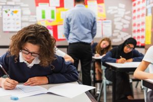 Students at their desks in a classroom